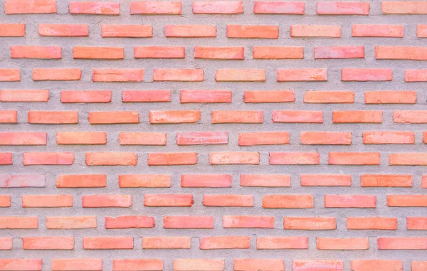 Orange and white brick wall texture background. Brickwork and stonework flooring interior rock old pattern clean concrete grid uneven bricks office design. Background old vintage brick wall backdrop