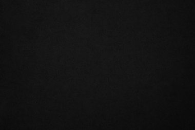 Black paper texture background. Black blank cardboard sheet page. Old vintage page dark grunge vignette. Pattern rough art rustic grunge letter. Material cardboard with copy space for luxury text.