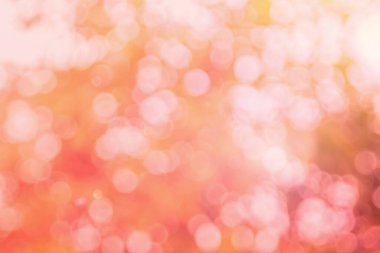 Soyut bulanık turuncu renk ve arkaplan şeftalisi, Görüntü festivali ışıkları açık hava ve pembe baloncuk odaklı desen dekorasyonu.