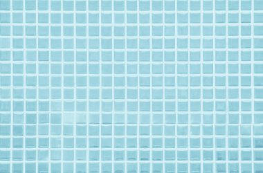 Blue light ceramic wall and floor tiles mosaic background in bathroom and kitchen. Design pattern geometric with grid wallpaper texture decoration pool. Simple seamless abstract surface clean.