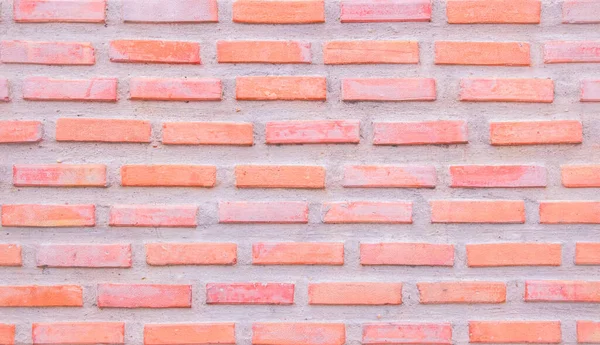 Orange and white brick wall texture background. Brickwork and stonework flooring interior rock old pattern clean concrete grid uneven bricks office design. Background old vintage brick wall backdrop