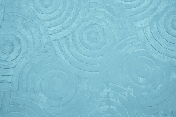Pastel blue concrete stone texture pattern curved for background in summer wallpaper. Cement and sand wall of tone vintage. Floor stamped concrete abstract surface clean polished on walkway in garden.