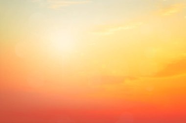 Abstract blurred sunlight beach colorful blurred bokeh background with retro effect autumn sunset sky have blue bright, white, and color orange calm. Blur gradient sunset background on soft nature sunrise  outdoor. Abstract evening clouds blur.