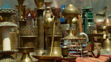 Many different size copper candlesticks