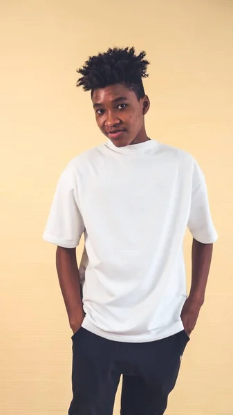 Portrait of young African American teenager merrily pose in studio — Stock Photo, Image