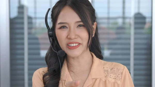 Video call camera view of businesswoman talks actively in videoconference