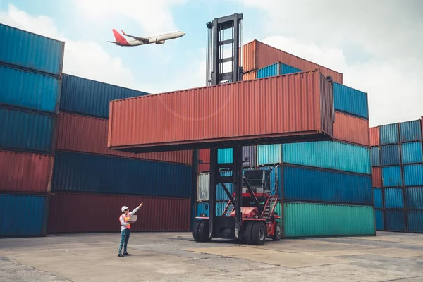 Cargo container for overseas shipping in shipyard with airplane in the sky .