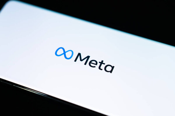 Meta logo is shown on a device screen