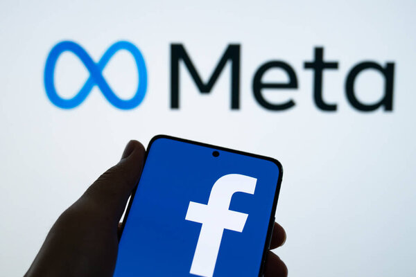 Meta logo is shown on a device screen