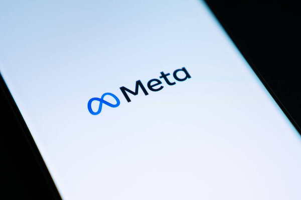 Meta logo is shown on a device screen