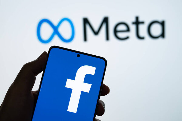 Meta logo is shown on a device screen
