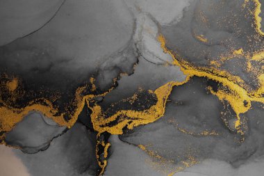 Kağıt üzerinde mermer sıvı mürekkep resminin koyu altın soyut arkaplanı .