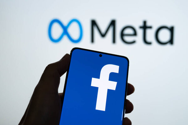Meta logo is shown on a device screen