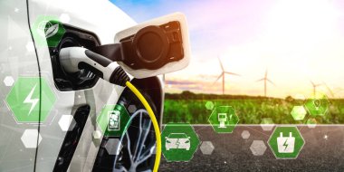 Yeşil sürdürülebilir enerji kavramında elektrikli araba için EV şarj istasyonu