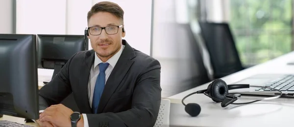 Business people wearing headset working in office broaden view — Stock Photo, Image