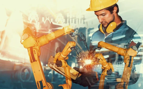 Mechanized industry robot arm and factory worker double exposure — Stock Photo, Image