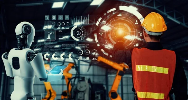 Робот механизированной промышленности и человеческий работник, работающие вместе на будущем заводе — стоковое фото
