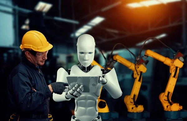 Mechanizovaný průmysl robot a lidský pracovník spolupracující v budoucí továrně — Stock fotografie