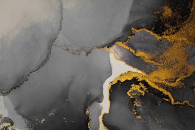 Kağıt üzerinde mermer sıvı mürekkep resminin koyu altın soyut arkaplanı .