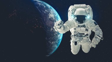 Astronot uzay yürüyüşü yaparken uzay uçuşları görevinde çalışıyor.