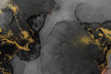 Kağıt üzerinde mermer sıvı mürekkep resminin koyu altın soyut arkaplanı .