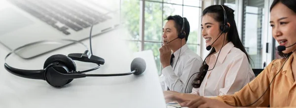 Business team wearing headset working actively in office — Stock Photo, Image