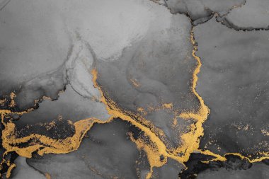 Kağıt üzerinde mermer sıvı mürekkep resminin koyu altın soyut arkaplanı .
