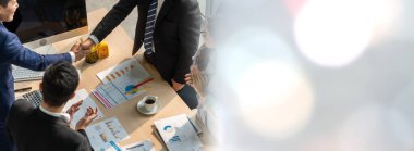 Group business people handshake at meeting table in widen view