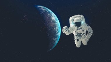 Astronot uzay yürüyüşü yaparken uzay uçuşları görevinde çalışıyor.
