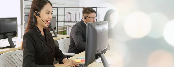 Business people wearing headset working in office broaden view