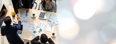 Group business people handshake at meeting table in widen view