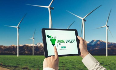 Çevre tasarrufu ve ESG iş konsepti için yeşil iş dönüşümü. İşadamı, çevre dostu yönetime ve alternatif temiz enerji kullanımına yönelik kurumsal bir hedef belirlemek için tablet kullanıyor.