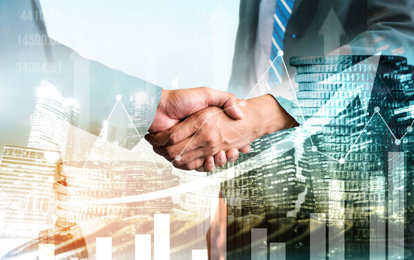 Business handshake on finance prosperity and money technology asset background . Economy and financial growth by investment in valuable stock market to gain wealth profit form currency trading