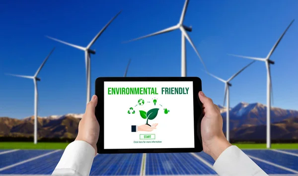 Green business transformation for environment saving and ESG business concept. Businessman using tablet to set corporate goal toward environmental friendly management and alternative clean energy use.