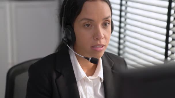 Competent African American Female Operator Working Computer While Talking Clients — Stok video