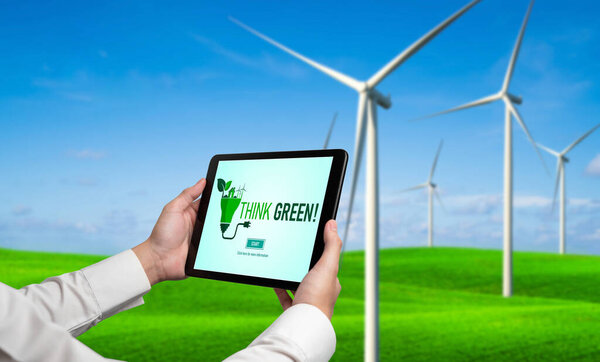 Трансформация "зеленого" бизнеса в целях экономии окружающей среды и бизнес-концепция "Эко". Бизнесмен, использующий планшет, чтобы установить корпоративную цель в сторону экологически чистого управления и альтернативного использования чистой энергии.