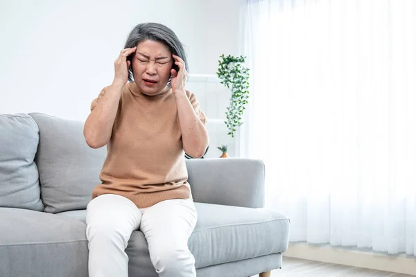 Agonizing Senior Woman Headache Compress Her Temple Both Hands Her — Stockfoto