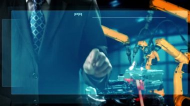 Engineer use cybernated robotic software to control industry robot arm in factory . Automation manufacturing process controlled by specialist using IOT software connected to internet network .