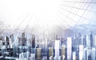 As background for a financial or business concept, digital screen and financial graphs overlap on a picture of modernistic cityscape, skyscrabbers.