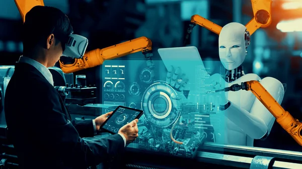 Cybernated industry robot and human worker working together in future factory . Concept of artificial intelligence for industrial revolution and automation manufacturing process .