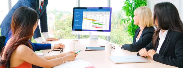 Project planning software for modish business project management on the computer screen showing timeline chart of the team project