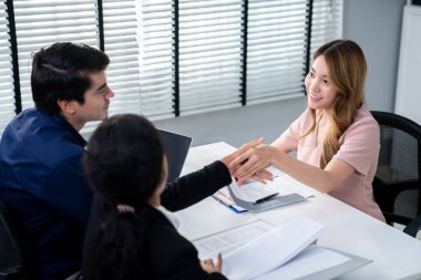 A new and competent female employee successfully interviewed. Newly graduated gets her first job after the interview.