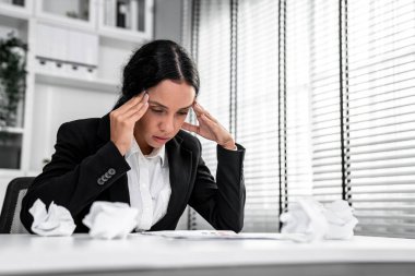 A competent female employee who has become completely exhausted as a result of overburdened work. Concept of unhealthy life as an office worker, office syndrome, effect from overwork.