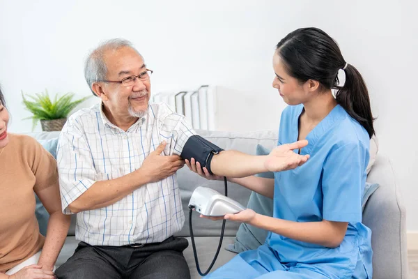 Elderly Man Having Blood Pressure Check His Personal Caregiver His — Stockfoto