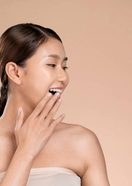 Portrait of ardent young woman with healthy clear skin and soft makeup looking at camera and posing beauty gesture. Cosmetology skincare and beauty concept.