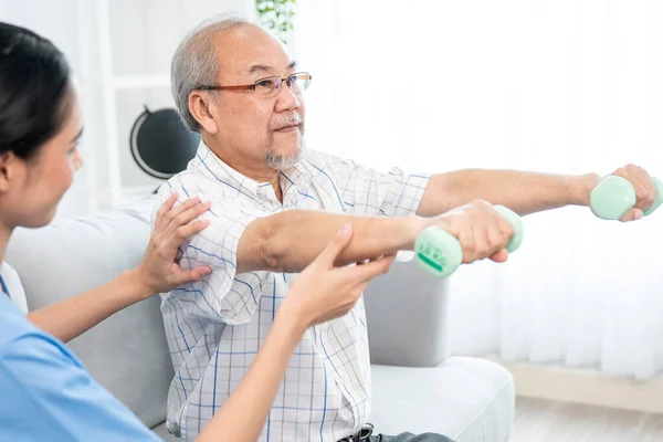 Contented Senior Patient Doing Physical Therapy Help His Caregiver Senior —  Fotos de Stock