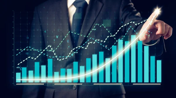 Businessman draw finance allusive graph chart showing business profit growth increasing to future target . Excellent financial status of corporate business rise up . Finance and money technology .