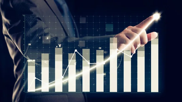 Businessman draw finance allusive graph chart showing business profit growth increasing to future target . Excellent financial status of corporate business rise up . Finance and money technology .