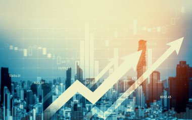 As background for a financial or business concept, digital screen and financial graphs overlap on a picture of modernistic cityscape, skyscrabbers.