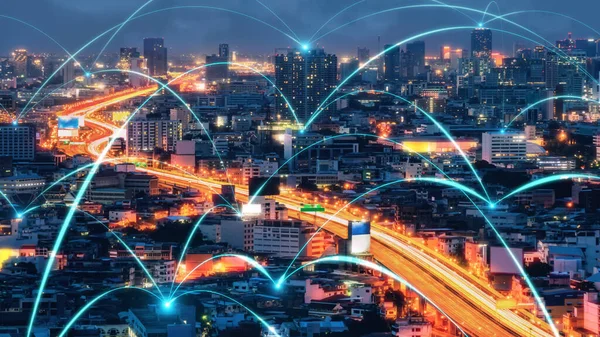 Smart digital city with connection network reciprocity over the cityscape . Concept of future smart wireless digital city and social media networking systems that connects people within the city .